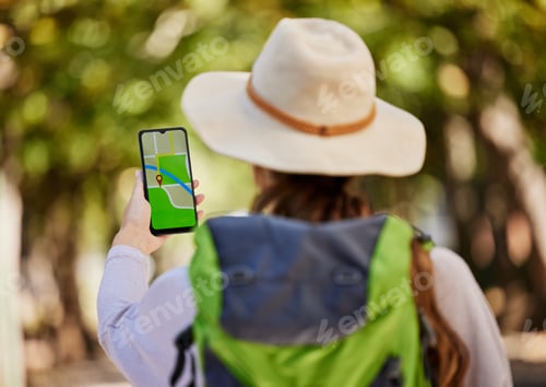 Preview: GPS, direction and woman hiking in a forest for exercise, adventure or wellness in nature. Navigati