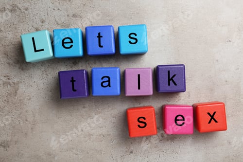 Preview: Colorful wooden blocks with phrase "LET'S TALK SEX" on stone background, flat lay