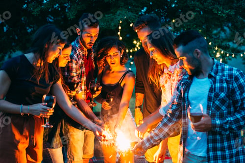 Preview: Happy friends doing barbecue outdoors