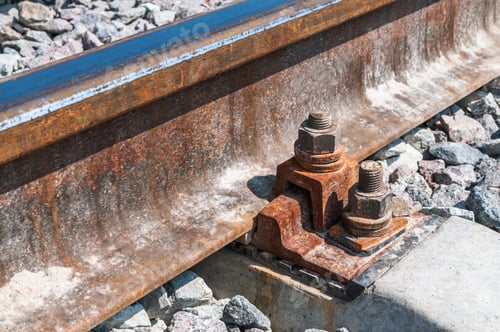 Preview: Railroad nut and bolt on background of gravel