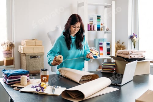 Preview: Small business owner woman packs the goods in eco packaging in office, shop.