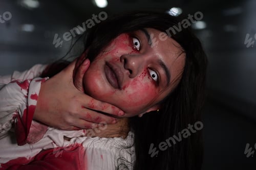 Preview: Scary woman in white dress with bloodstain after murder, Halloween concept