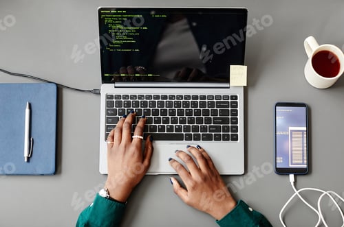 Preview: Programmer Writing Code Top View