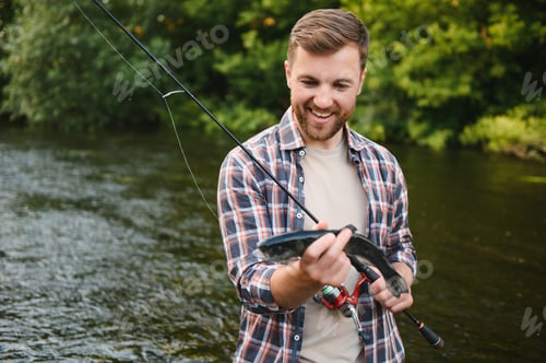 Preview: Fishing. Fisherman and trout. Fisherman on wild river.