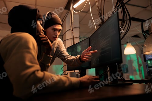Preview: Hackers discussing computer system hacking, coding malicious software