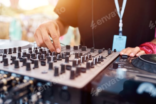 Preview: Close up of a DJ playing music on the outdoor party.