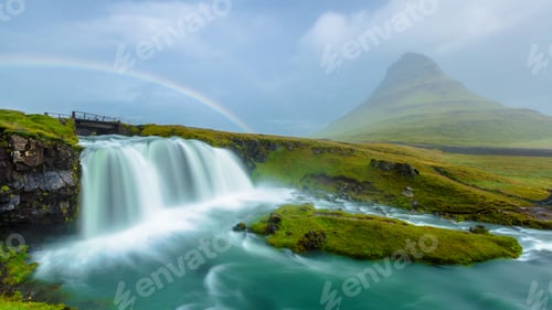Preview: Kirkjufellsfoss with a rainbow from a waterfall