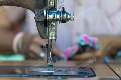 Preview: The vintage sewing machine on fashion designer blur background