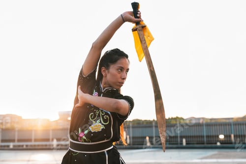 Preview: Chinese young woman practicing wushu kung fu.