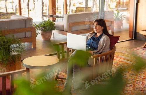 Preview: Woman working on a laptop