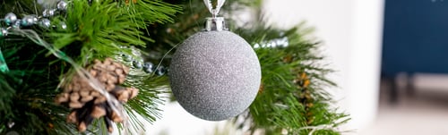 Preview: Silver Christmas ornaments hanging on fir tree. christmas ball. Christmas tree with silver ball