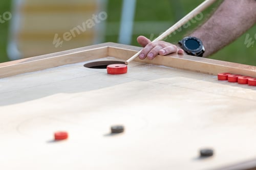Preview: Men playing Novuss. Novuss is a national sport in Latvia similar to pocket billiards or pool.