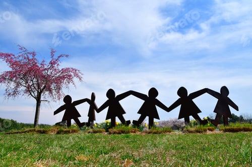 Preview: We are in this together - a sculpture that looks like paper dolls holding hands