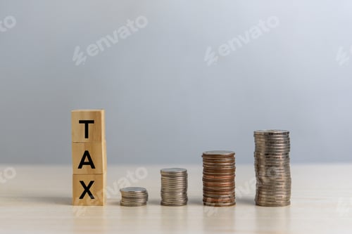 Preview: wood cube block TAX and coin money on desk. Business finance accounting income concept.