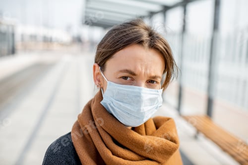 Preview: Portrait of a woman in face mask outdoors