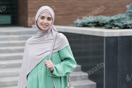 Preview: Smiling Woman Wearing Headscarf in City Setting