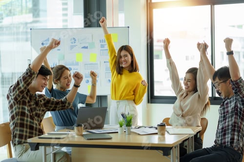 Preview: Group young Asian business people with the creative successful excited raised hands rejoicing.