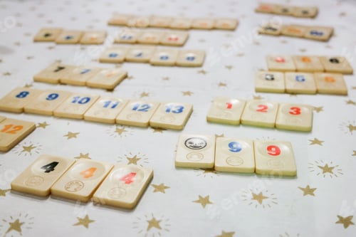 Preview: Rummikub Tiles Arranged on Starry Tablecloth