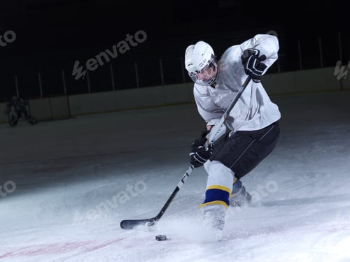 Preview: Ice Hockey Player In Action Kicking With Stick