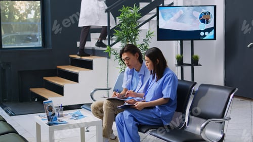Preview: Asian nurse helping patient