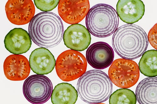 Preview: Fresh vegetables slices abstract pattern background,onion, cucumber and tomatoes