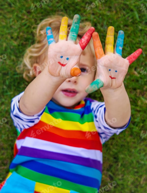 Preview: Child in hand draw smile. Selective focus.