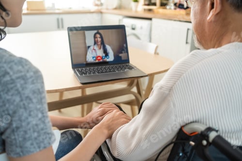 Preview: Asian senior male and daughter video call with doctor in living room.