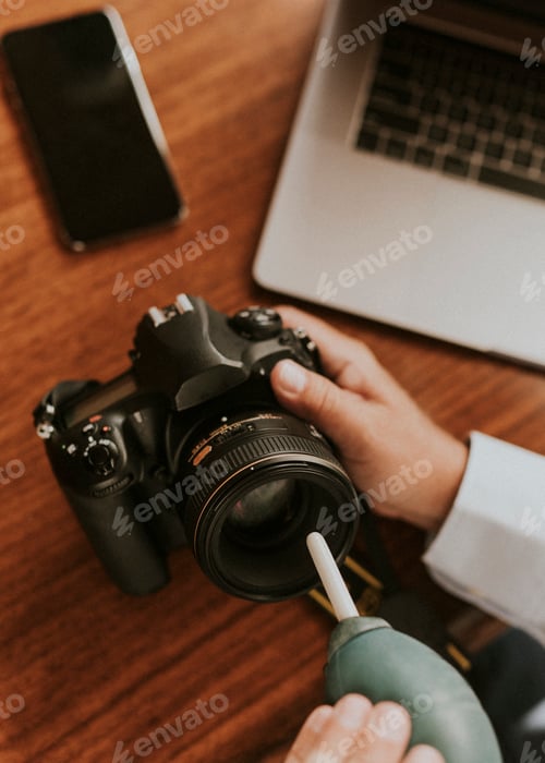 Preview: Man cleaning a camera