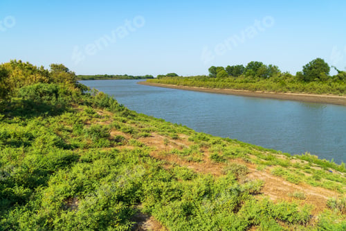 Preview: Coast of a wide flat river
