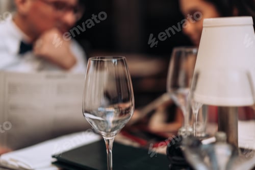 Preview: Empty wineglass in restaurant