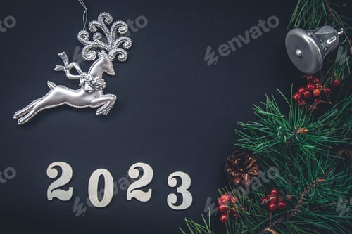 Preview: Christmas background with numbers 2023 and decor details, flat lay.