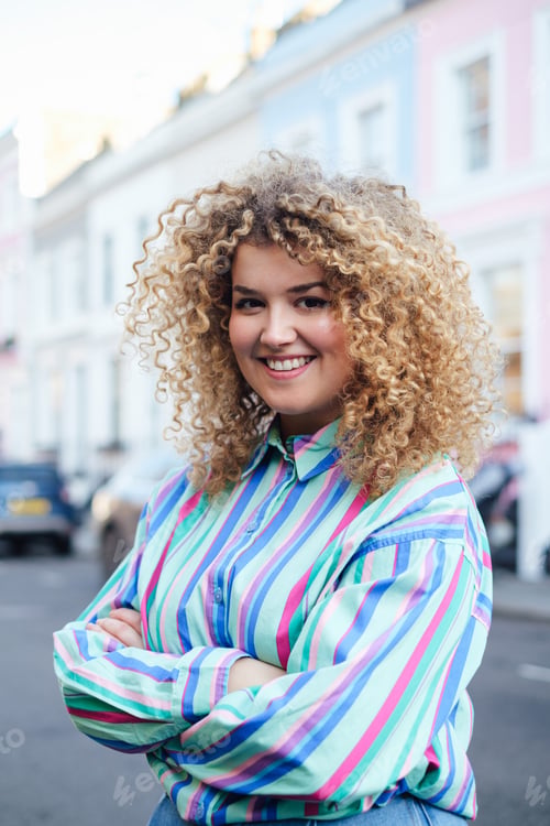 Preview: Portrait of young confident afro businesswoman