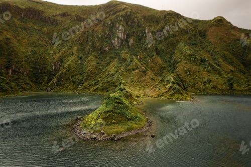 Preview: Rippling sea near green hilly shore