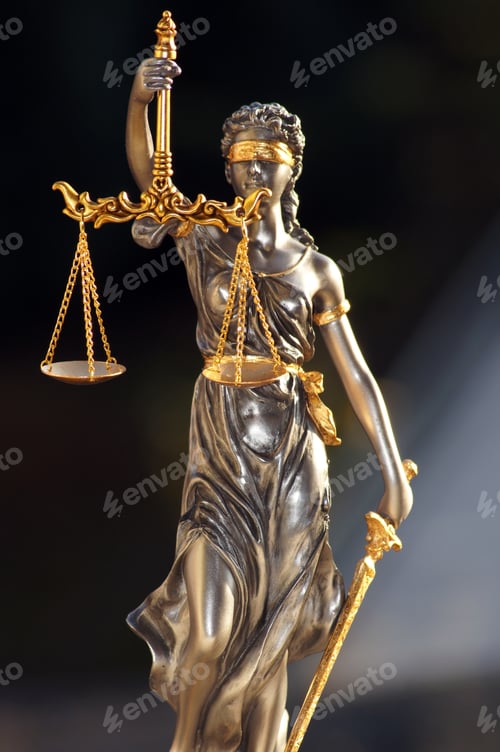 Preview: Vertical shot of Lady Justice isolated on dark background