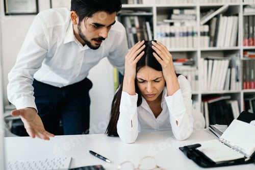Preview: Businessman yelling at female colleague in office