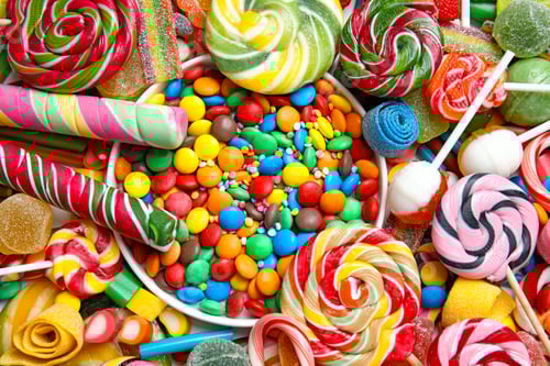 Preview: Many different yummy candies as background, top view