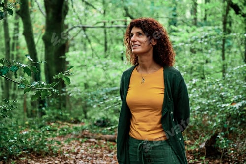 Preview: adult woman in a forest - autumn concept