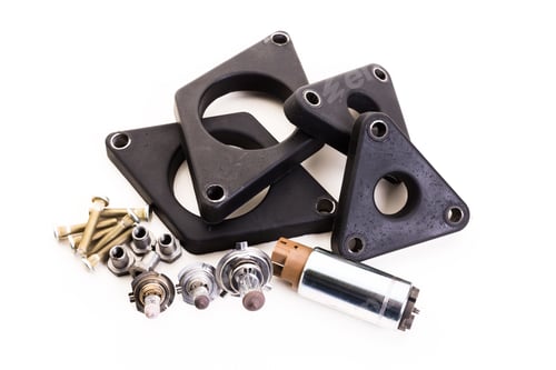 Preview: Automotive parts collection with various gaskets, bolts, and a motor from a workshop