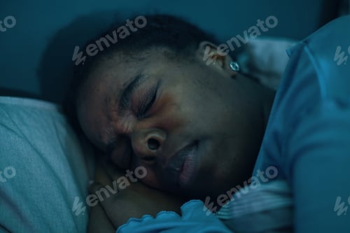 Preview: Sleeping Black Person Lying on Pillow During Nighttime