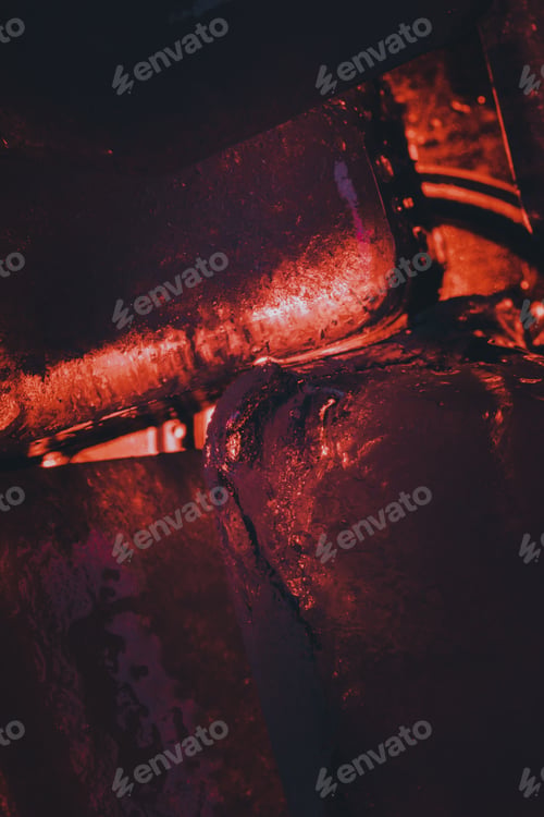 Preview: Closeup shot of ice cubes under red light
