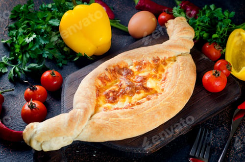 Preview: Khachapuri with cheese closeup. Adjarian open pie with mozzarella.