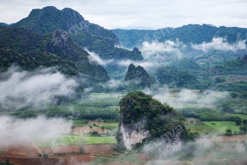 Preview: Landscape image of foggy greenery rainforest mountains and hills