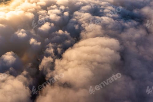 Preview: Thick layer of white clouds above mountains at sunrise