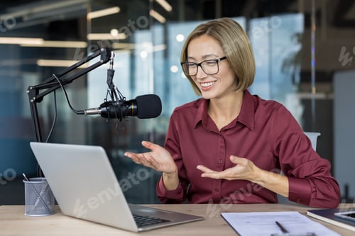 Preview: Asian woman broadcasting podcast live from modern office studio