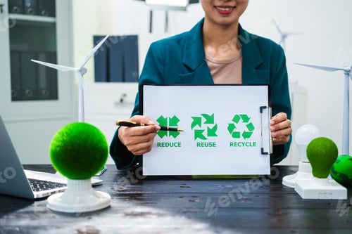 Preview: An Asian businesswoman sits at her desk, discussing clean energy solutions their impact on homes