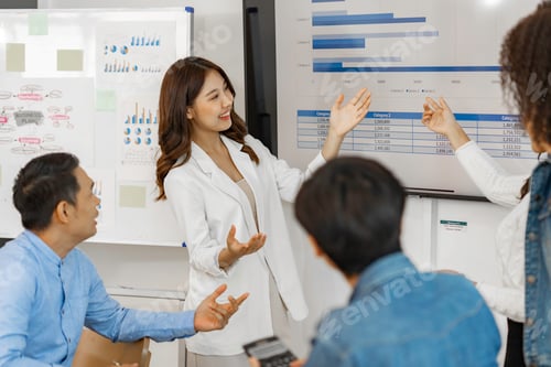 Preview: Business people working and brainstorming in office