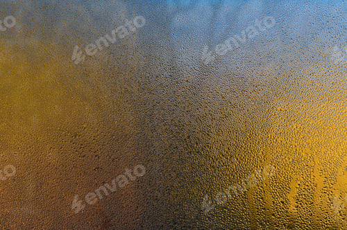 Preview: wet glass window, abstract backdrop. Water droplets merging into rivulets,