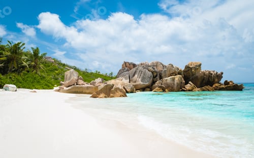 Preview: Anse Cocos beach with huge granite boulders at La Digue Seychelles Islands