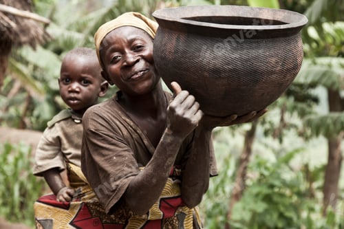 Preview: Woman carrying clay pot on shoulder with a child peeking from behind