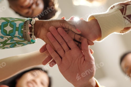 Preview: Uniting Hands of Diverse Young Adults Collaborating in Creative Coworking Space